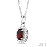 5x3 MM Oval Shape Garnet and 1/20 Ctw Single Cut Diamond Halo Semi-Precious Pendant with Chain in 10K White Gold