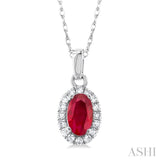 5x3 MM Oval Shape Ruby and 1/20 Ctw Single Cut Diamond Halo Precious Pendant with Chain in 10K White Gold