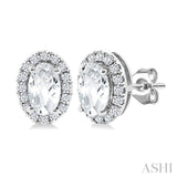 5x3 MM Oval Shape White Topaz and 1/8 Ctw Round Cut Diamond Halo Semi-Precious Stud Earrings in 10K White Gold