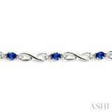 4x3 MM Oval Cut Sapphire and 1/10 Ctw Round Cut Diamond Bracelet in 14K White Gold