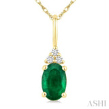 1/50 Ctw Oval Cut 6X4 MM Emerald and Round Cut Diamond Precious Pendant With Chain in 10K Yellow Gold