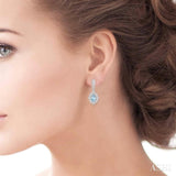 5x3 MM Oval Shape Aquamarine and 1/4 Ctw Round Cut Diamond Semi-Precious Earrings in 10K White Gold