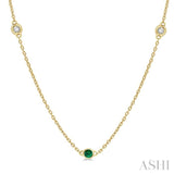 1.75 MM Emerald and 1/6 Ctw Round Cut Diamond Precious Station Necklace in 14K Yellow Gold