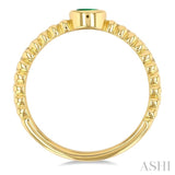 4x3 MM Oval Shape Emerald and 1/5 Ctw Round Cut Diamond Precious Fashion Split Twin Ring in 10K Yellow Gold