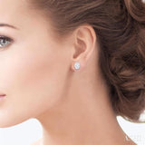 1/5 Ctw Petite Bezel Set Oval Cut Diamond Fashion Stud Earrings in 10K White Gold