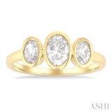 1 Ctw 3-Stone Bezel Set Oval Cut Diamond Ring in 14K Yellow Gold