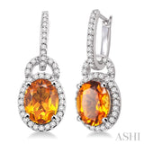 9x7mm Oval Cut Citrine and 3/8 Ctw Round Cut Diamond Earrings in 14K White Gold